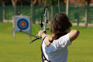 Back,Of,Archery,Athlete,Aiming,At,A,Target,In,The